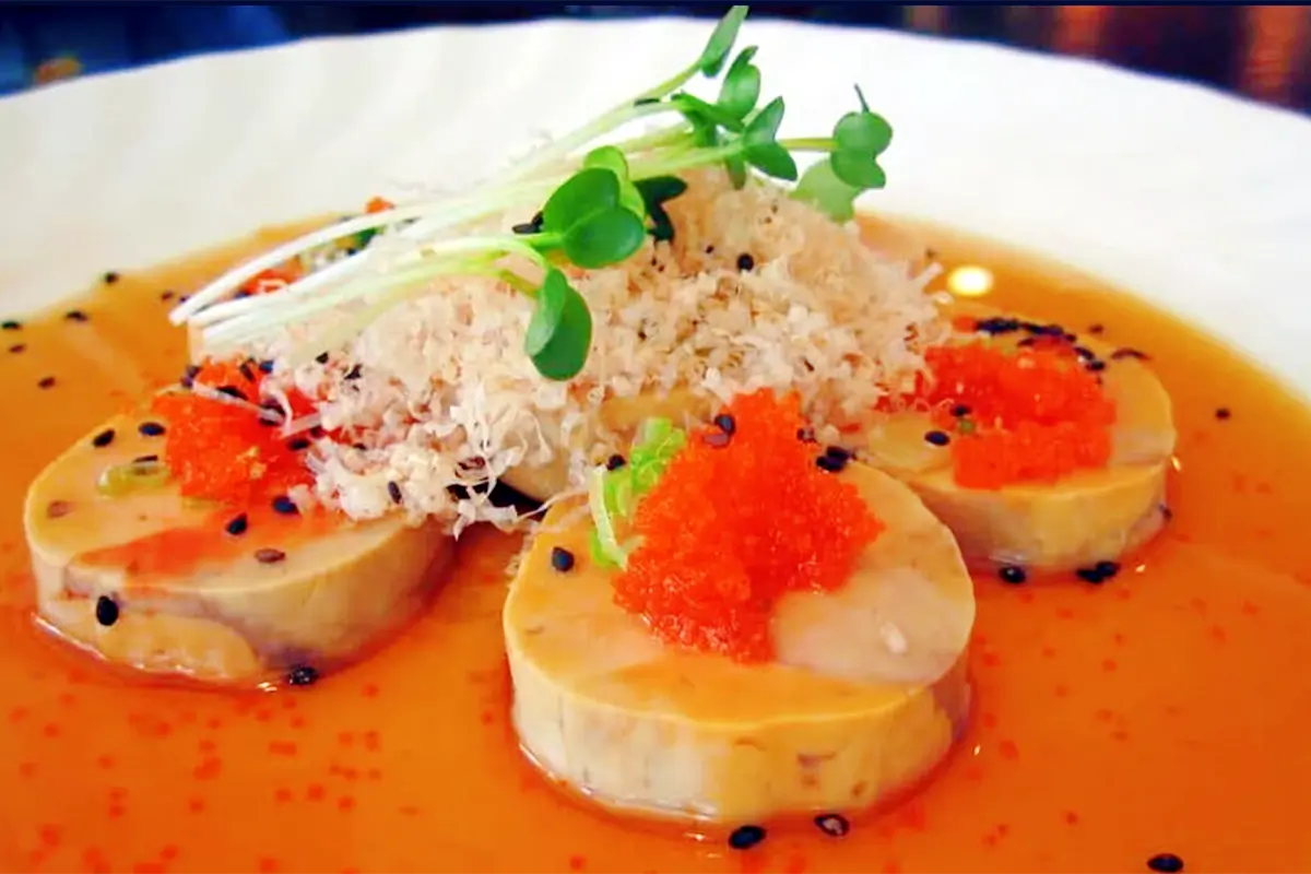 Abalone slices in orange sauce, topped with red caviar, shredded ingredients and microgreens at Senro Sushi, a Sushi restaurant in San Ramon