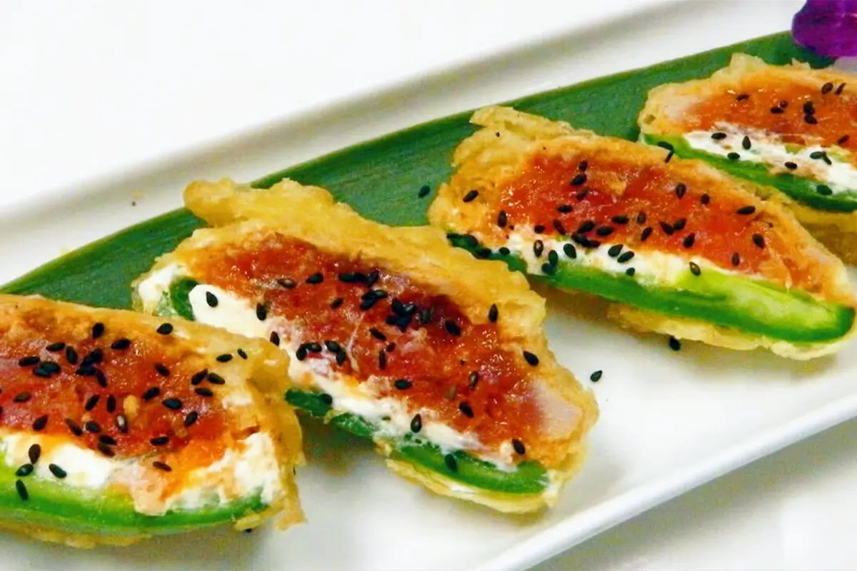 Crispy tempura jalapeno, cream cheese filling, salmon topping, black sesame sprinkle at Senro Sushi, a Sushi restaurant in San Ramon